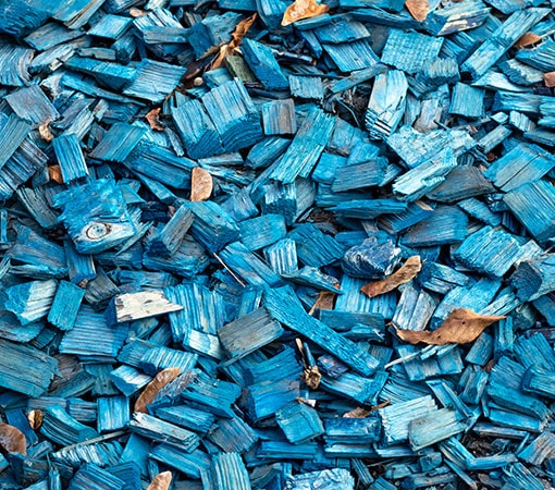 Blue wood waste chip mulch